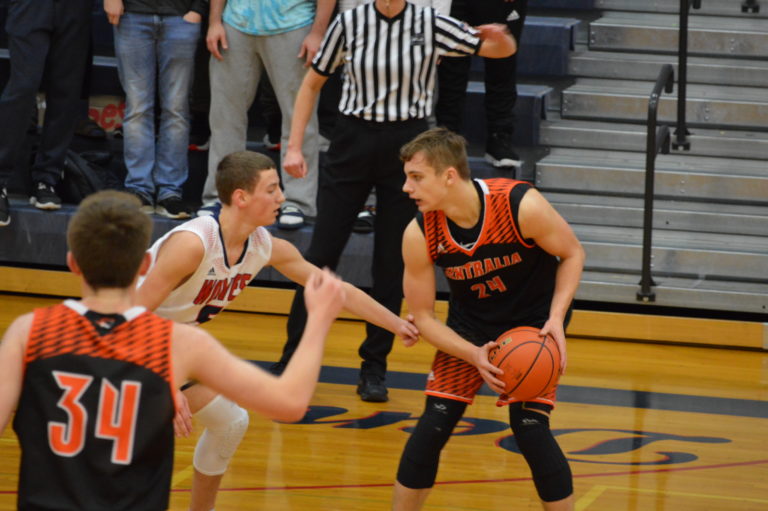 Boys Hoops: Ben Janssan’s 3-point bomb propels Tigers over scrappy Wolves